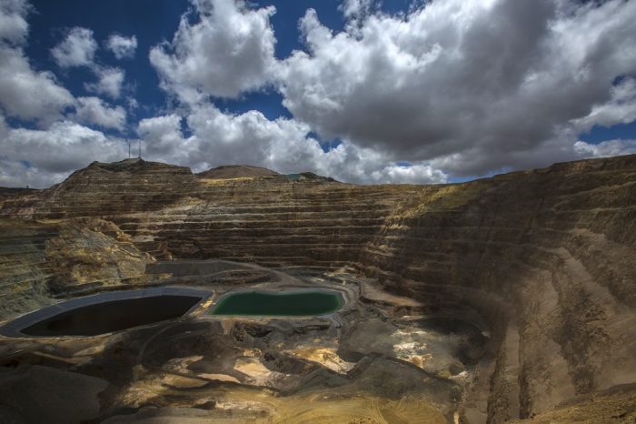 Acid water lagoons, resulting from the mining process, sit at the Yanacocha gold mine in Cajamarca, Peru, on Wednesday, Oct. 21, 2015. Operations at Yanacocha, South America's largest gold mine, are a joint venture between Newmont Mining Corp., Minas Buenaventura and International Finance Corp. Photographer: Dado Galdieri/Bloomberg
