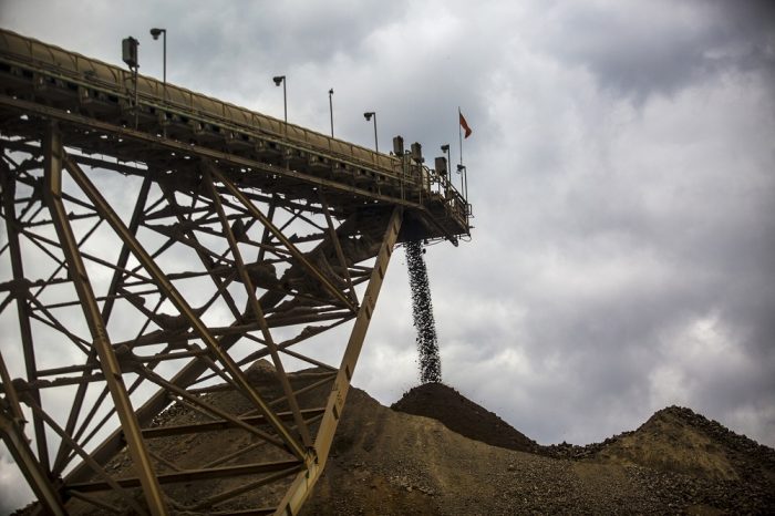Crushed stones and mined soil of "high fineness" are deposited in a pile before being processed  at the Yanacocha gold mine in Cajamarca, Peru, on Wednesday, Oct. 21, 2015. Operations at Yanacocha, South America's largest gold mine, are a joint venture between Newmont Mining Corp., Minas Buenaventura and International Finance Corp. Photographer: Dado Galdieri/Bloomberg