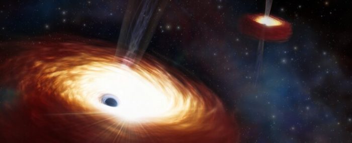 Astronómos miden el par de agujeros negros más pesado jamás encontrado